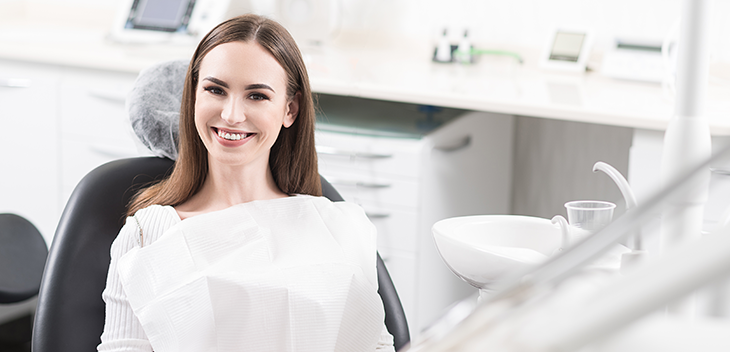 Woman smiling on dentist chair